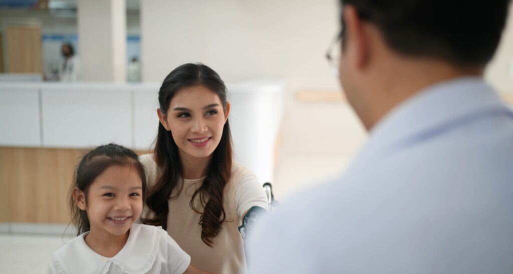Child meeting a friendly dentist before first dental appointment.