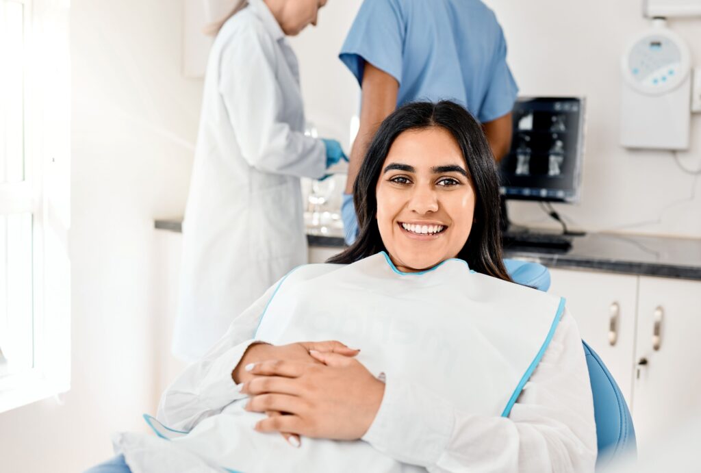 smiling patient after some dental treatment 