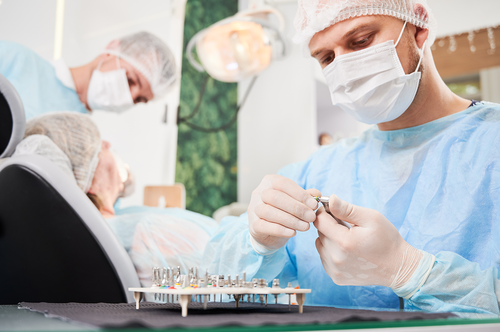 Dentist working with dental implant