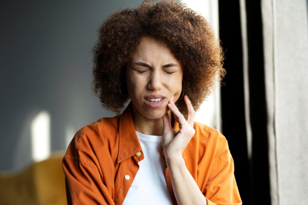 Woman with a severe tooth ache