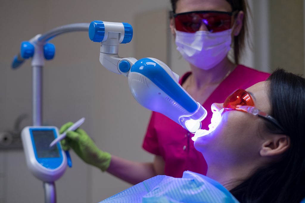 patient during laser teeth whitening in Winnipeg dental clinic