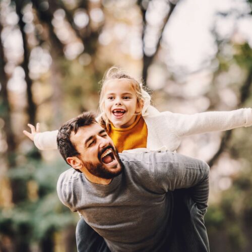 smiling father and daughter orthodontic