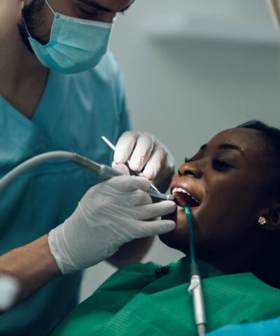 dentist doing scaling and root planing of a patient