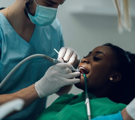 dentist doing scaling and root planing of a patient