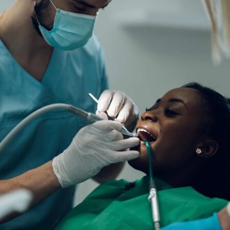 dentist doing scaling and root planing of a patient